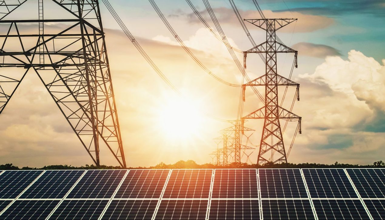 Solar panels with electricity pylon and sunset. Clean power ener Solar panels with electricity pylon and sunset. Clean power energy concept