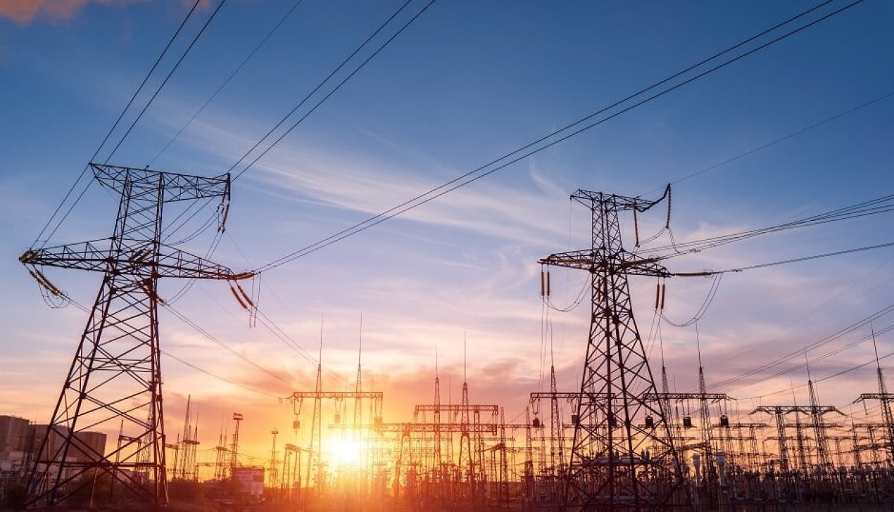 High-voltage power lines at sunset or sunrise. High voltage electric transmission tower High-voltage power lines at sunset or sunrise. High voltage electric transmission tower.