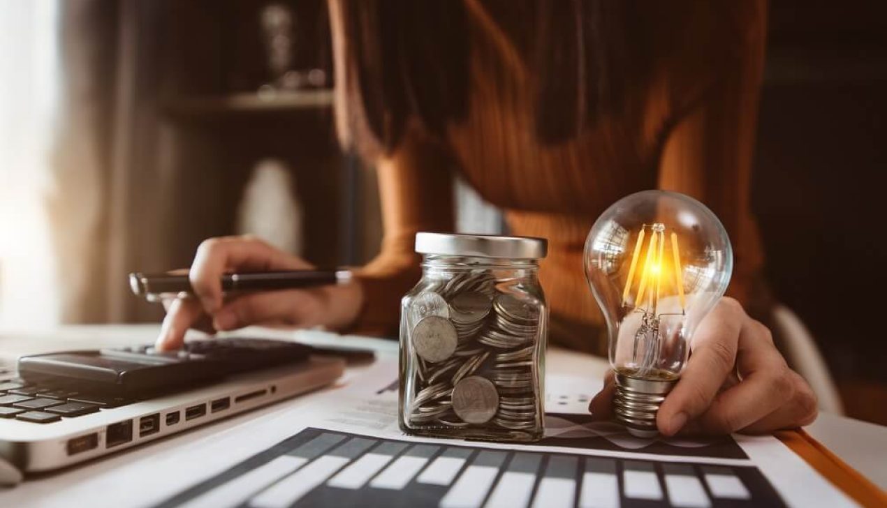 business hand holding lightbulb with using laptop computer and m business hand holding lightbulb with using laptop computer and m