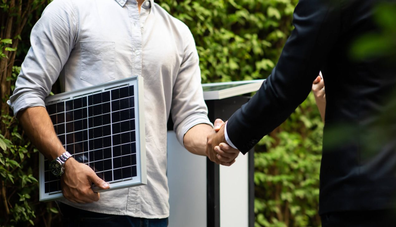 Electrical Engineer Technician and CEO executive business people Electrical Engineer Technician and CEO executive business people making handshake after meeting. clean and green alternative energy concept.